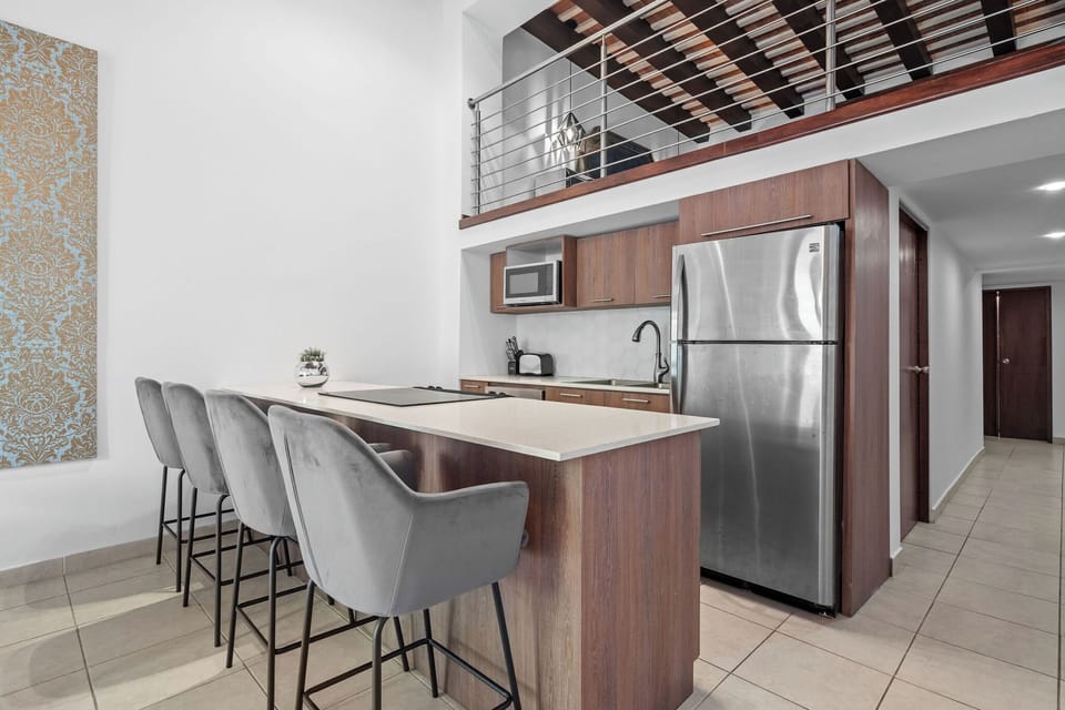 The fully equipped kitchen with seating for 4 in the island.