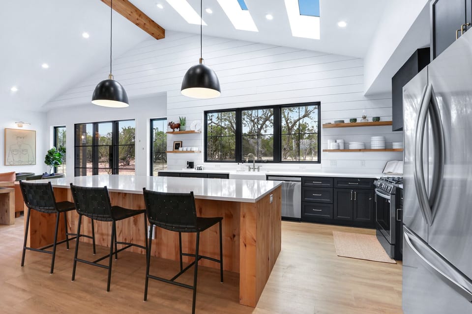 The kitchen is located behind the living room