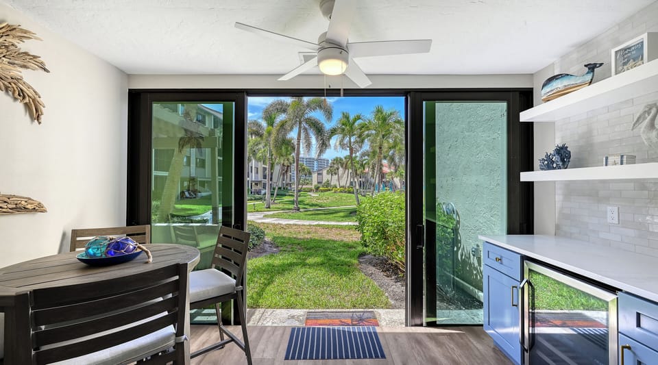 Step inside to discover tropical garden views framed perfectly through your private glass doors. The open layout blends modern comfort with an easy flow to the lush outdoors, inviting you to unwind.