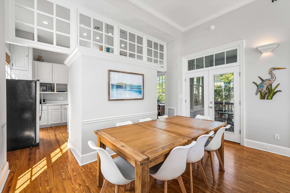 Multiple doors lead to the screened-in balcony