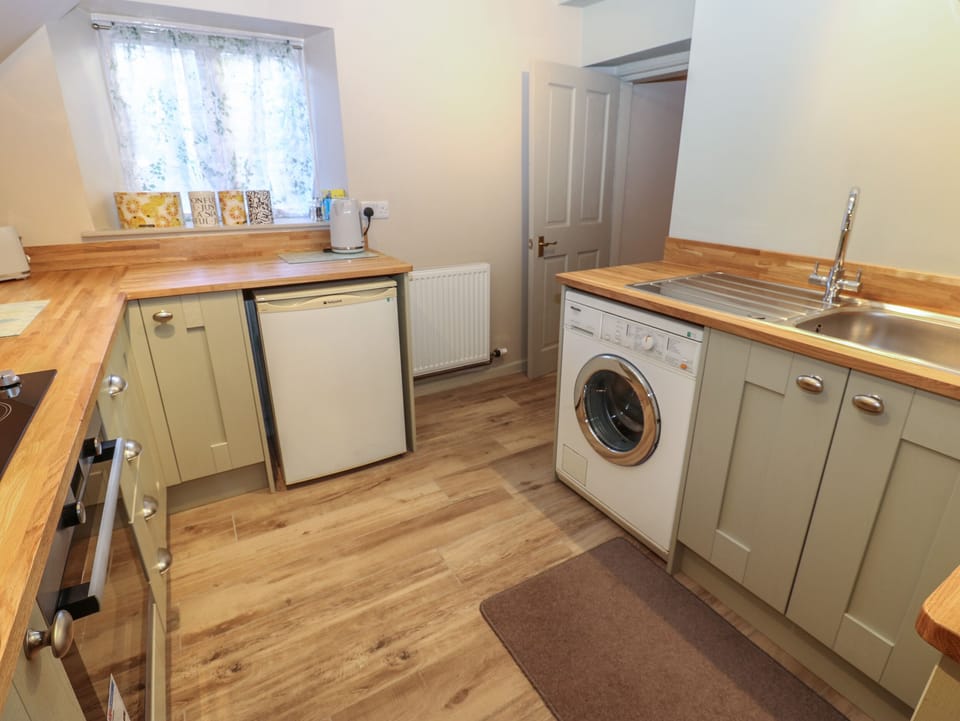 Fridge, electric kettle, cookware/dishes/utensils