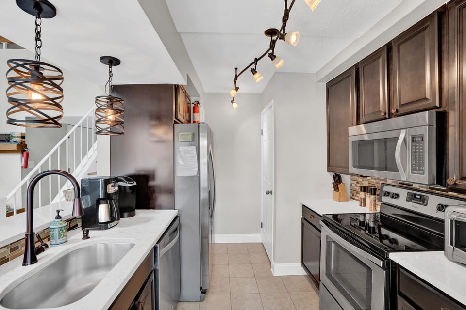 Modern stainless kitchen open to living room