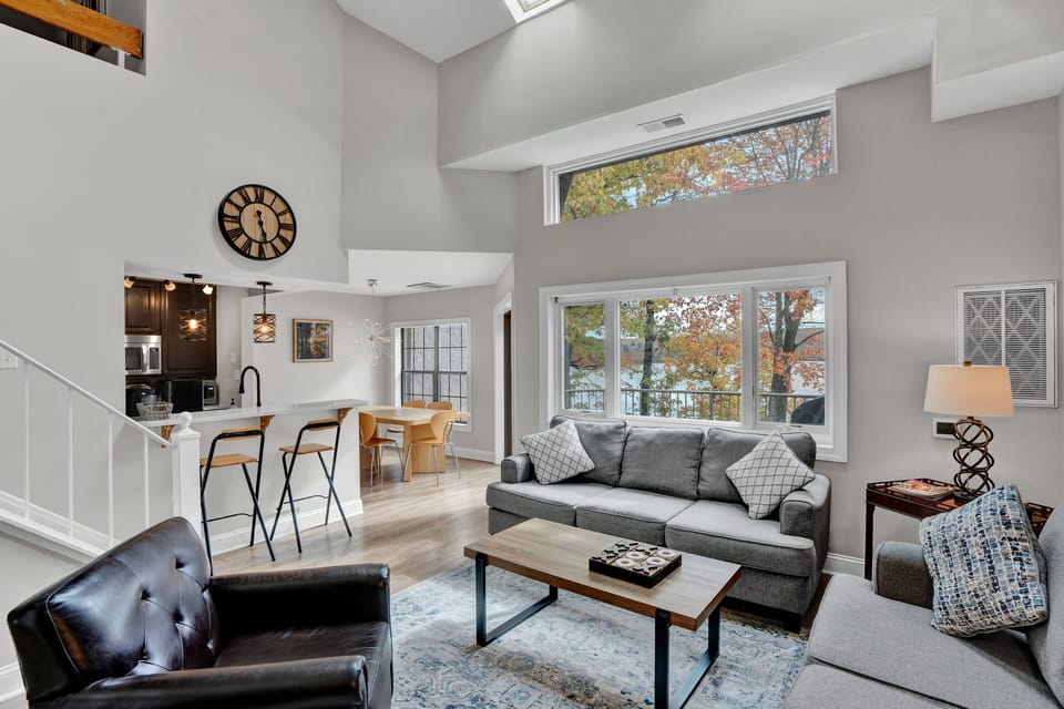 View towards kitchen and dining area from bright and airy living room. Nice view