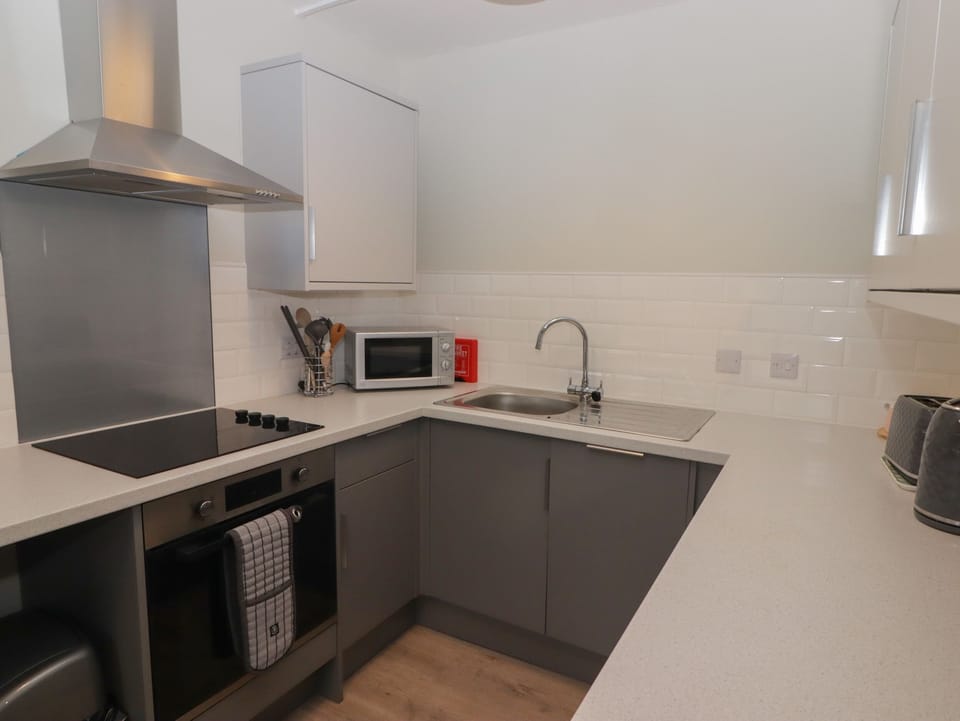 Fridge, dishwasher, electric kettle, cookware/dishes/utensils