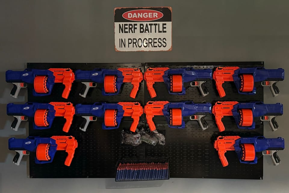 Wall-mounted nerf guns ready for an exciting battle