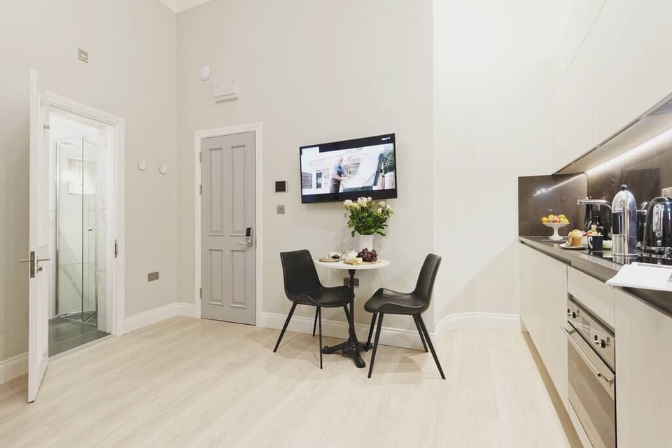 Living room area and bathroom entrance.
