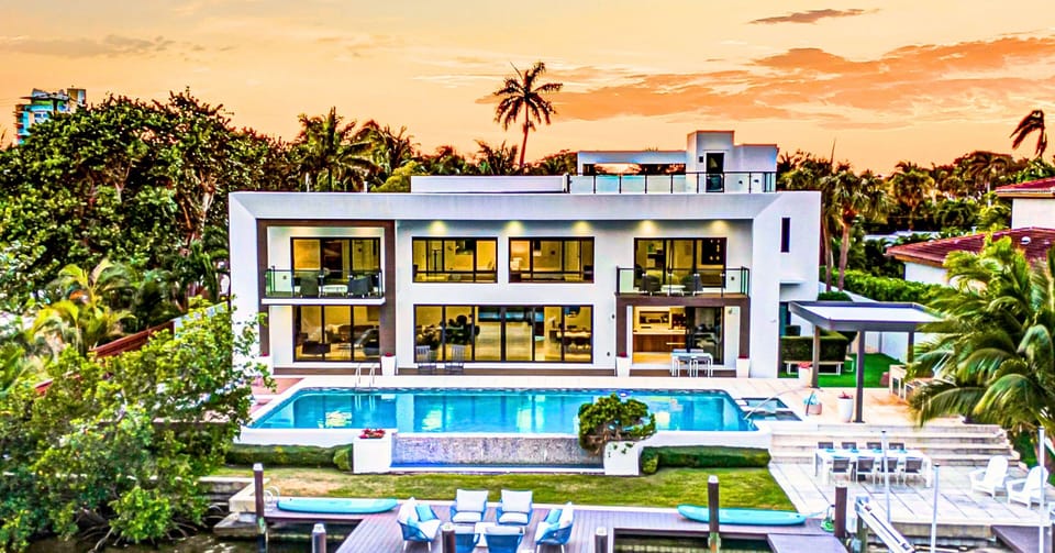 This exquisite waterfront modern villa embodies the quintessence o tranquility and serenity just a short 10 min walk to Bahia Mar beach and steps from restaurants.