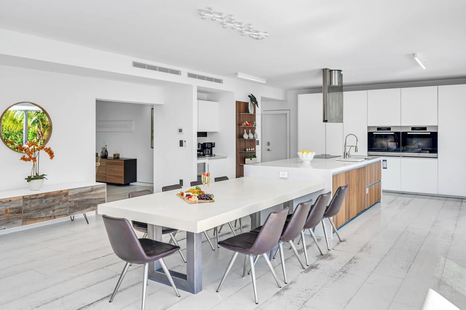 The kitchen offers indoor seating for ten, outdoor breakfast nook, outdoor dinning table for eight.