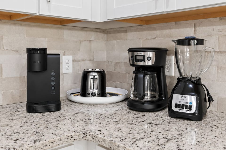 Well-stocked kitchen featuring a coffee maker, blender, toaster, and generous counter space to make your stay feel like home.