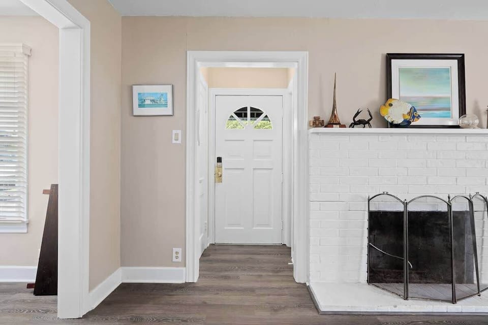  Welcoming entryway with a cozy fireplace and charming details to greet you as you arrive.