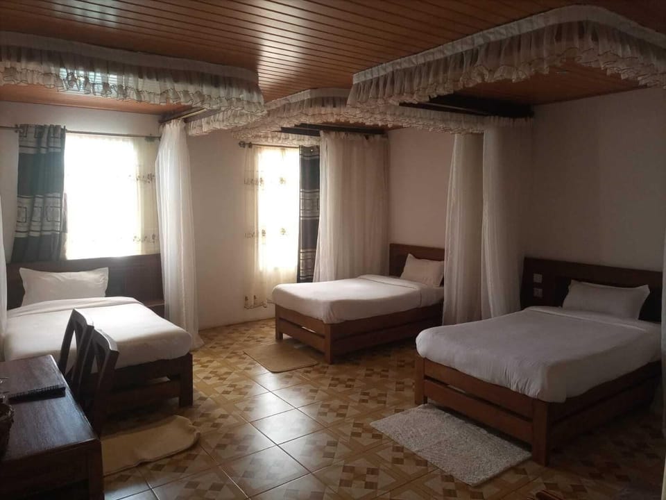 Family Triple Room | Desk, laptop workspace, iron/ironing board, free WiFi