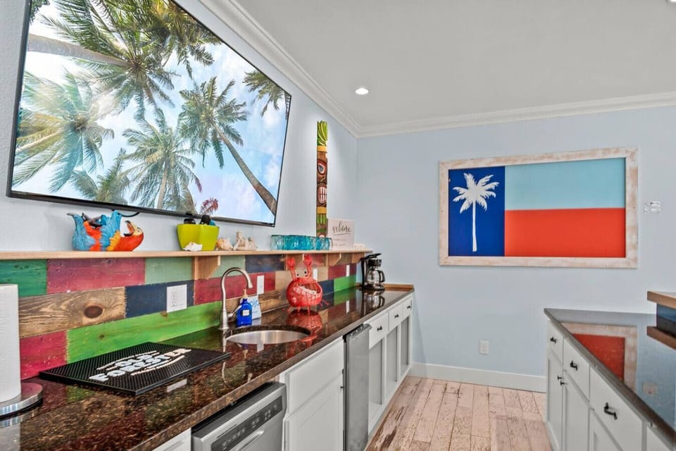 Vibrant beach-themed kitchen with large windows