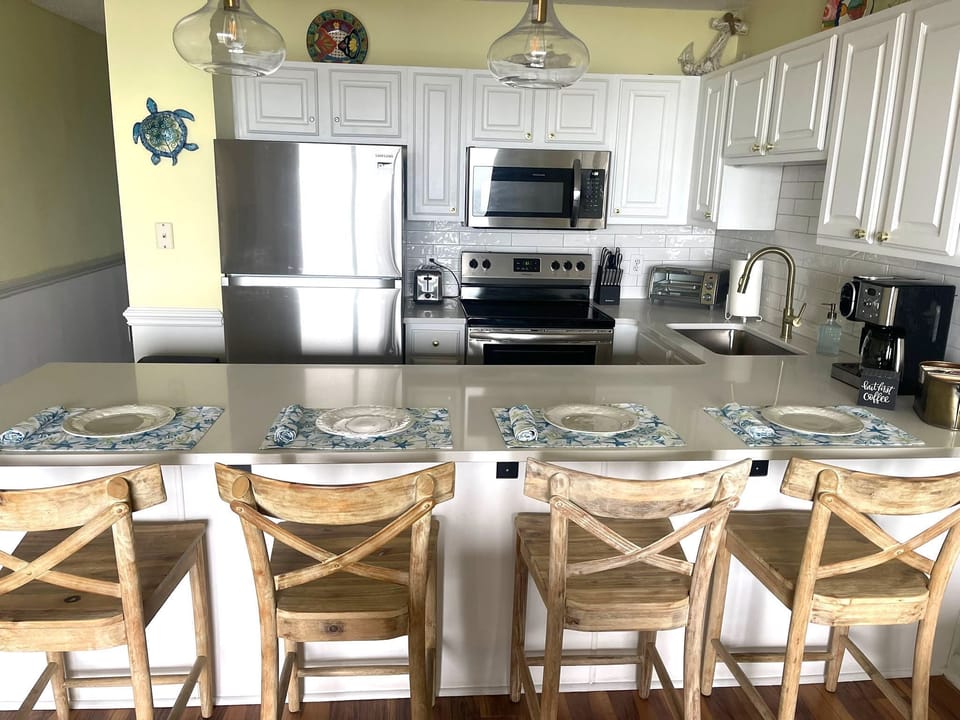 Open kitchen with counter seating for 4.