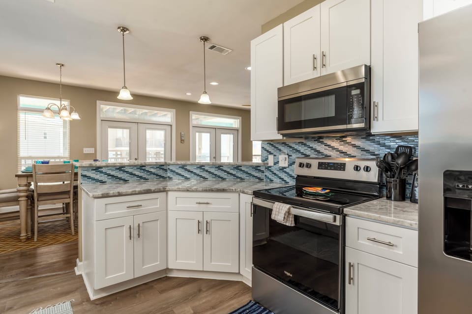 Your fully equipped kitchen features modern appliances and granite countertops, perfect for preparing meals during your stay.
