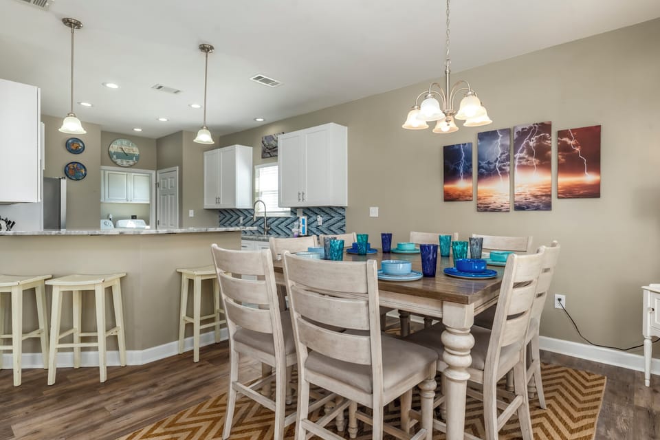 Gather around your spacious dining table for memorable meals, with an open kitchen nearby for easy entertaining and conversation.