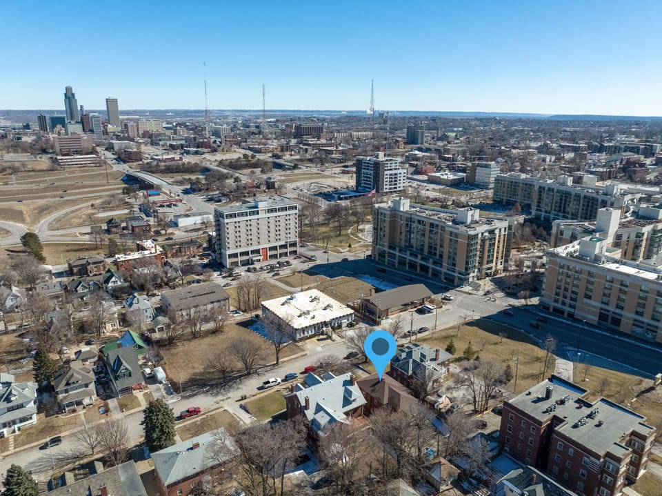 Aerial view showcasing the urban landscape and downtown skyline, with the property conveniently located in this vibrant city neighborhood.
