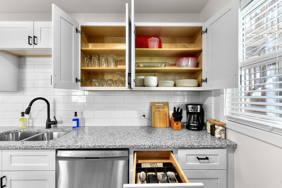 Your fully equipped kitchen awaits with granite counters, stainless appliances, and thoughtfully stocked cabinets for effortless meal prep.