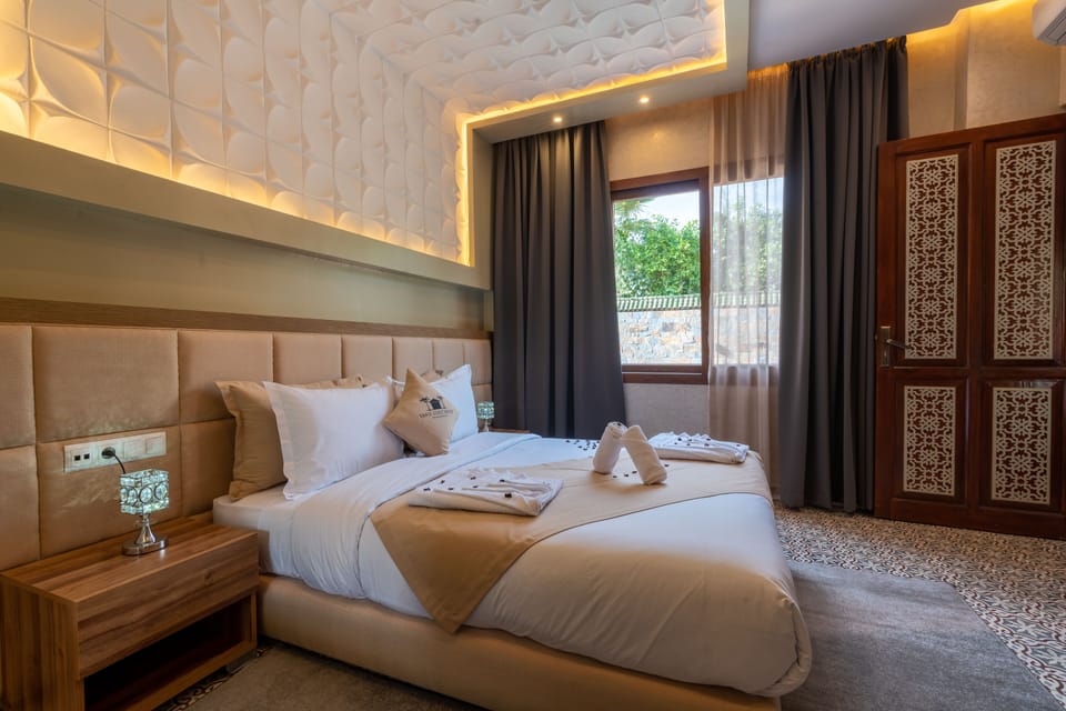 Family Suite, Pool View | In-room safe, iron/ironing board, free WiFi