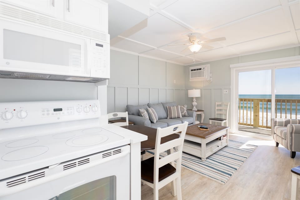Views of the ocean beyond the living room from kitchen