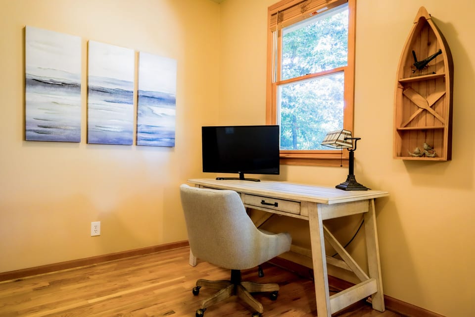 Desk area with monitor and printer