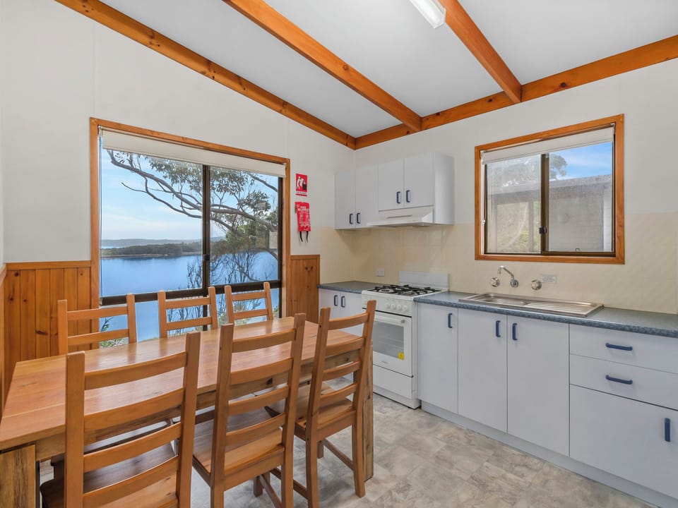 Standard Waterfront 2 Bedroom Cabin | Private kitchen | Full-size fridge, microwave, stovetop, toaster