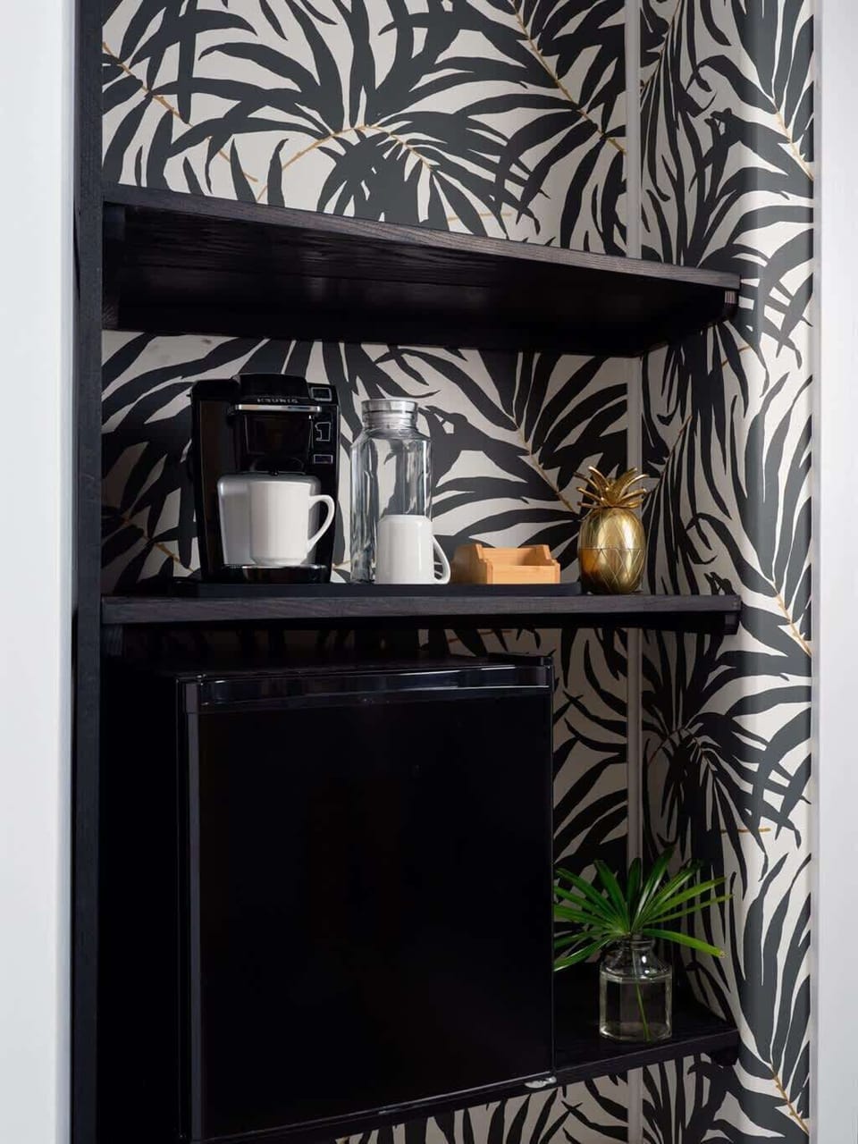 Your caffeine corner! Stylish shelves, mini-fridge, and that island feel. Start your day right. 