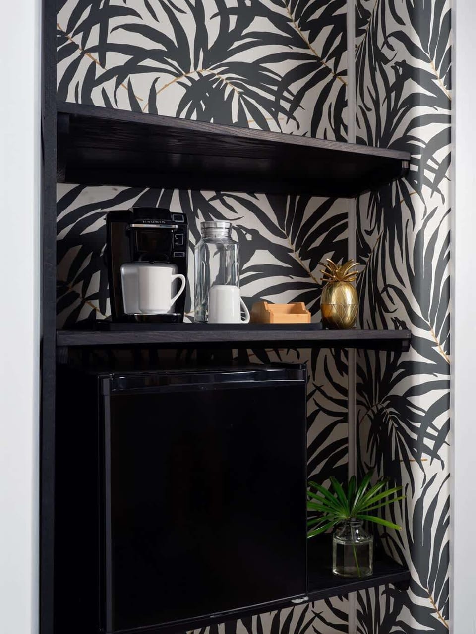 Wake up to island vibes with your own coffee bar—fresh brews, bold wallpaper, and tropical touches that make mornings feel like a mini getaway. 
