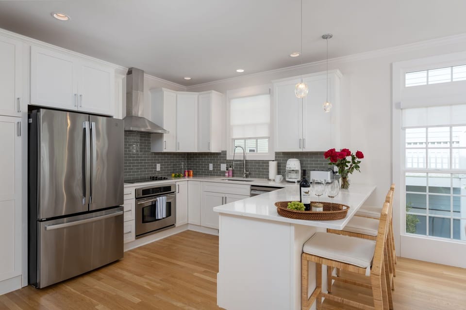 Stainless steel appliances and stocked kitchenware
