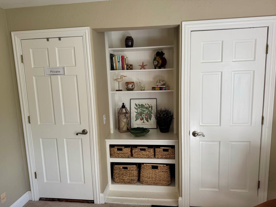 Upstairs bedroom has a full bed and ensuite bath with shower.