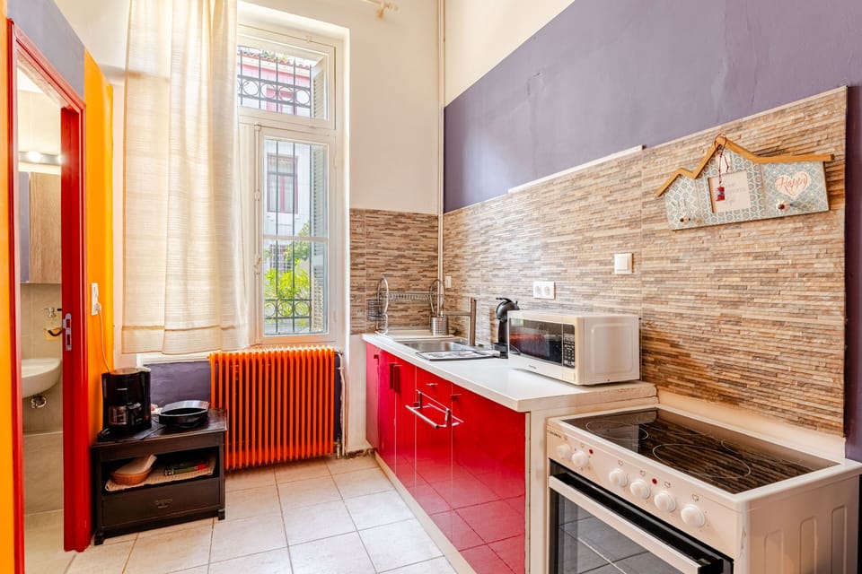 microwave, kitchen visible,  coffee and  coffee maker, kitchen, oven, stovetop