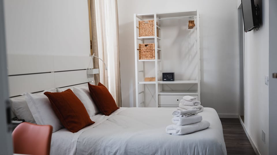 Deluxe Room, Balcony, City View | Premium bedding, in-room safe, individually decorated