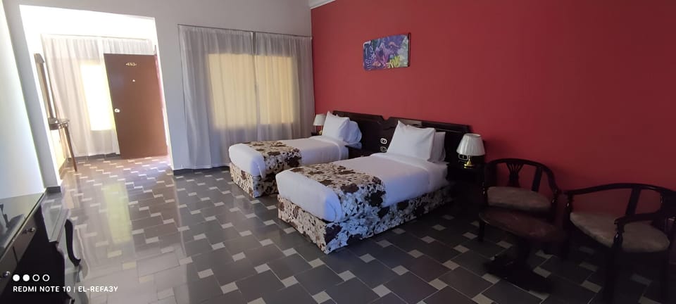 Standard Twin Room | Minibar, in-room safe, blackout drapes, free rollaway beds