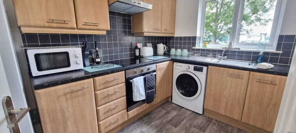 Comfort Apartment | Private kitchen | Full-size fridge, microwave, oven, stovetop