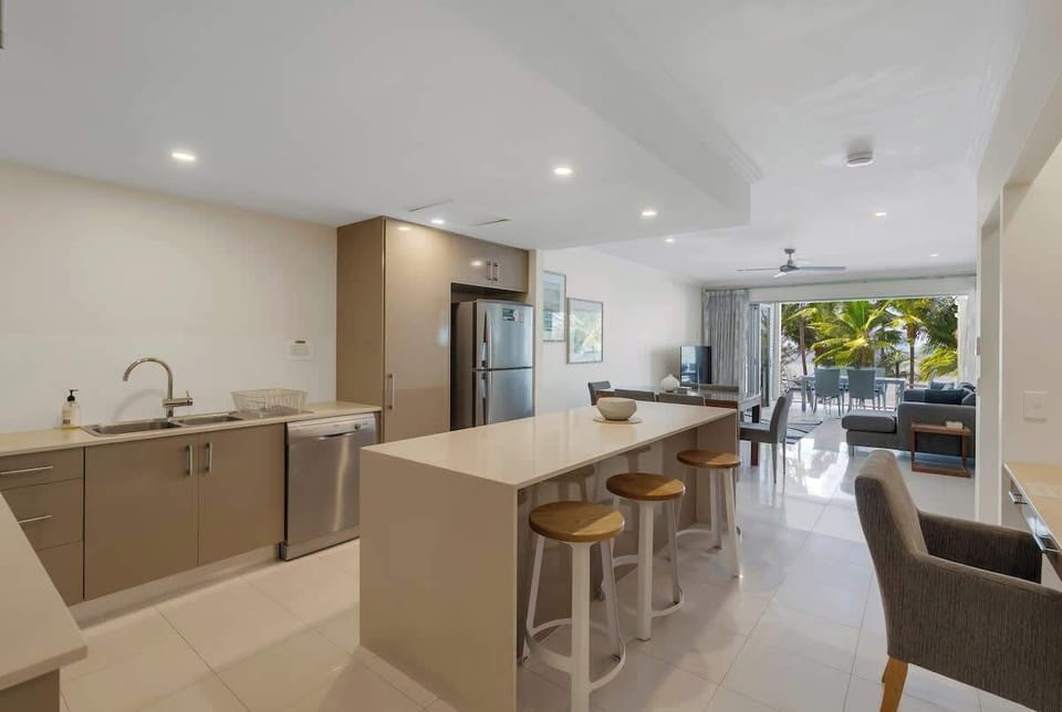 The kitchen is fully-equipped for your holiday catering, offering premium appliances and a central island.