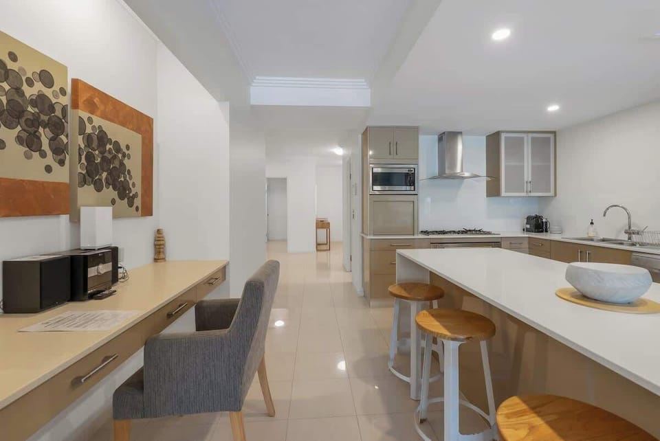 A dedicated workspace off the kitchen offers space to set up your laptop for Zoom calls during your stay.