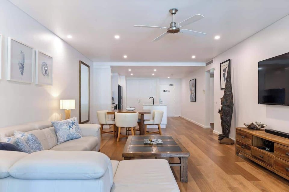 Unwind in the expansive open-plan living area, perfect for cosy gatherings or quiet relaxation.