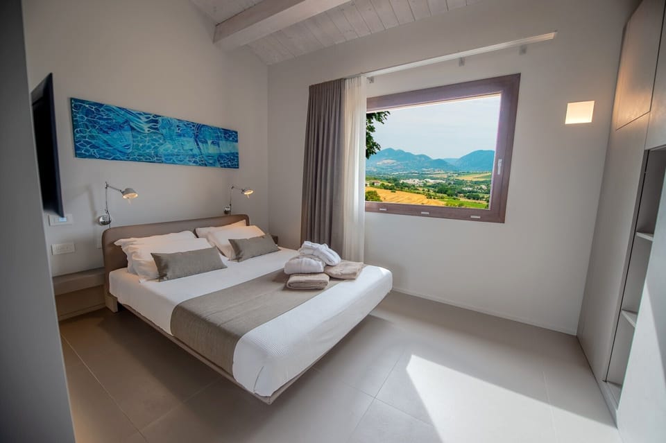 Junior Suite, Garden View (Sibillini) | Down comforters, pillowtop beds, in-room safe, individually decorated