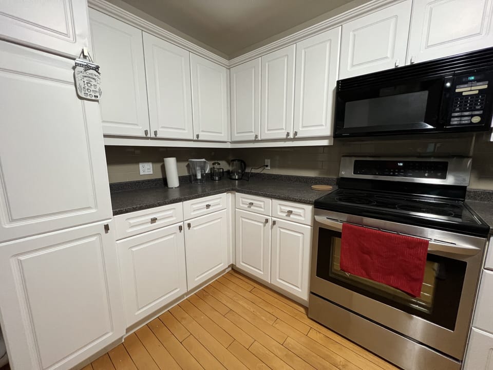 Full kitchen with dishwasher, fridge, stove, microwave