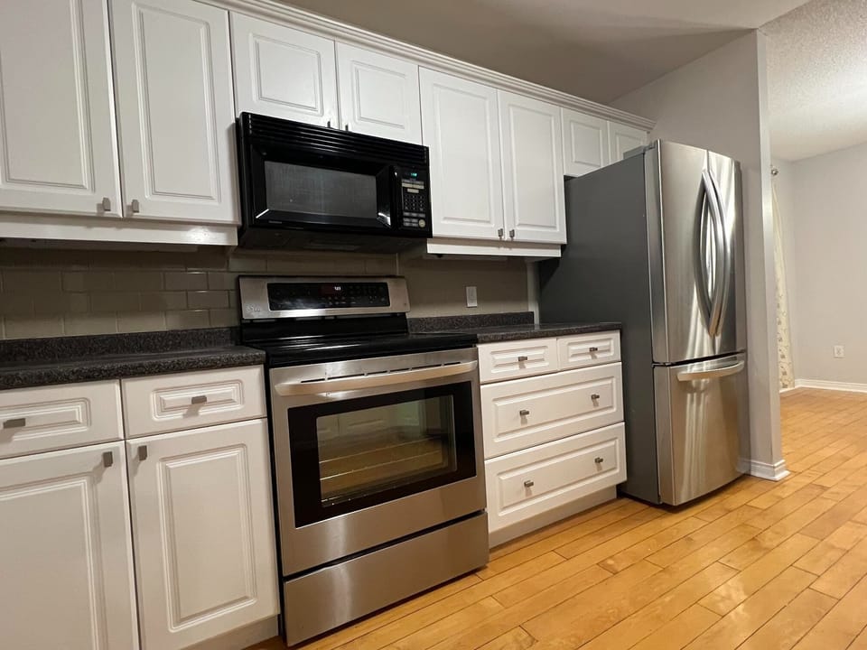 Full kitchen with dishwasher, fridge, stove, microwave