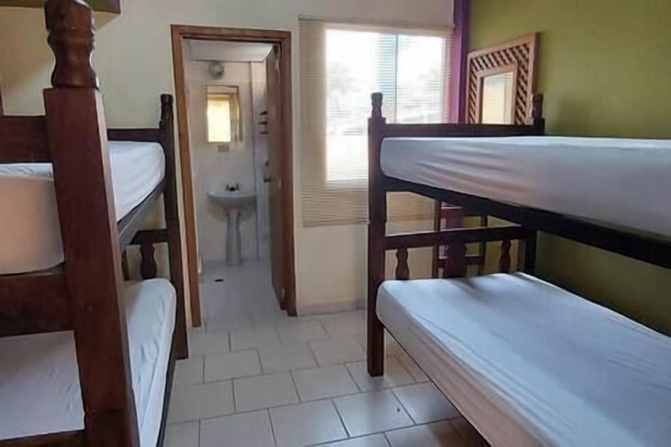 2nd bedroom with 2 bunker beds and a private bathroom.