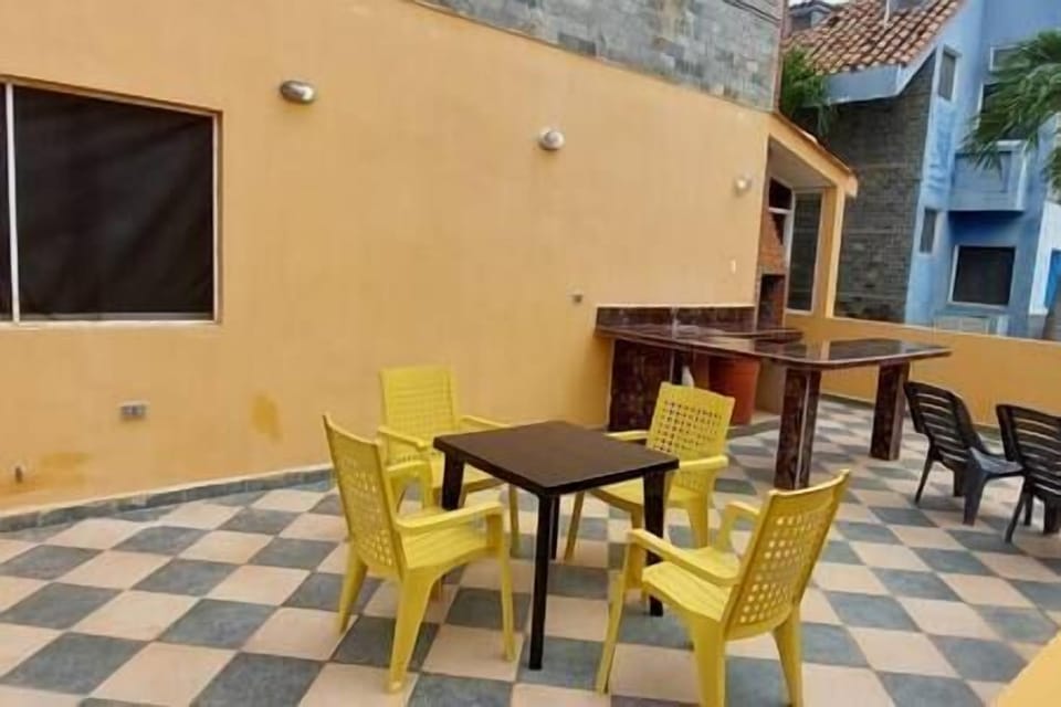 BBQ area with a concrete table. We also have a plastic table and chairs that can be used outside.