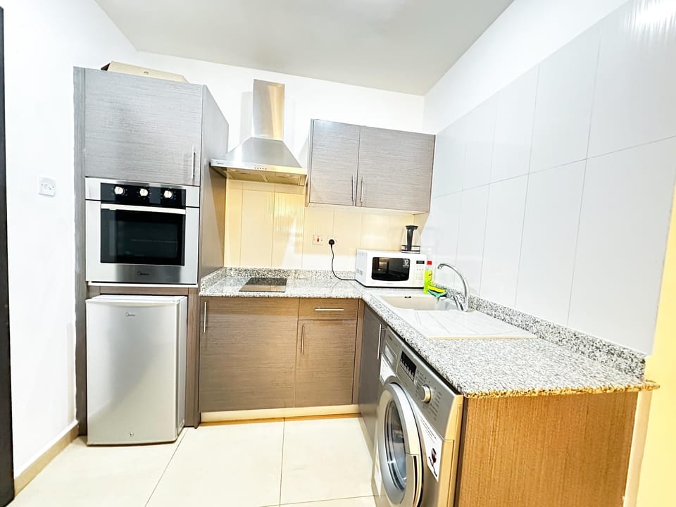 Luxury Studio | Private kitchen | Full-size fridge, microwave, oven, stovetop