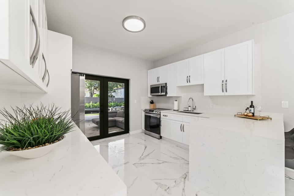 Indulge in the beauty of simplicity in our stunning kitchen oasis. 