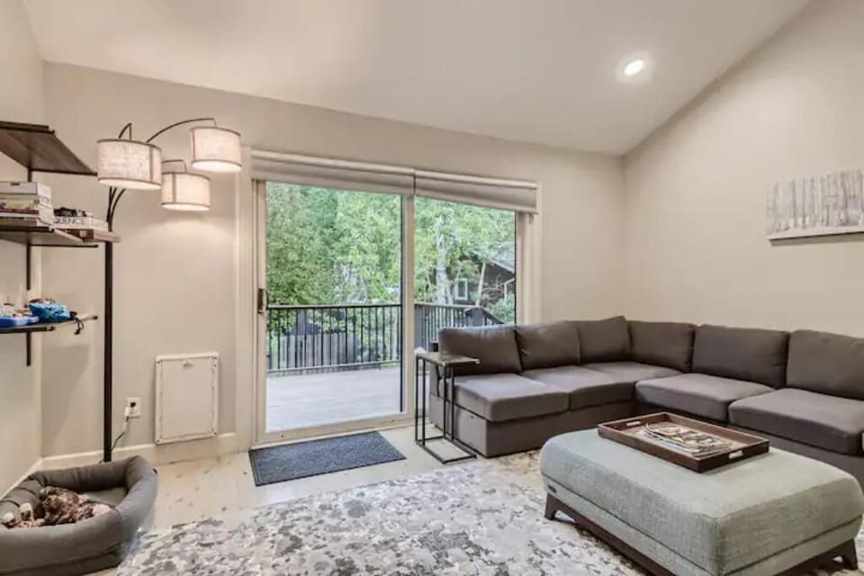 Living room opens to bright and sunny deck.