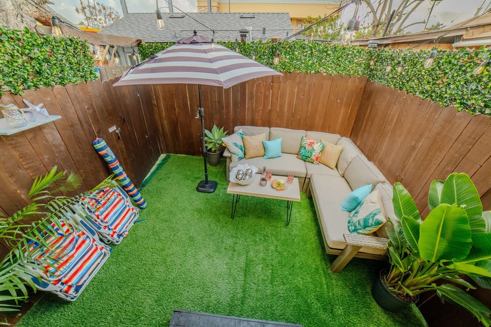 The outdoor patio is fenced for privacy.