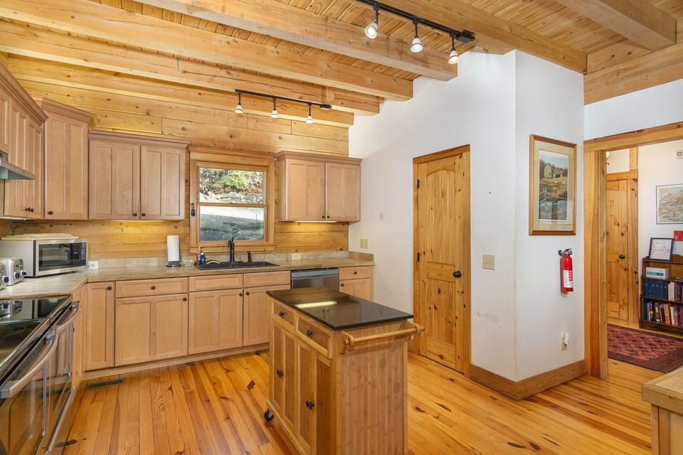 Spacious kitchen with double oven, dishwasher, and drip-style coffeemaker with option for Keurig.