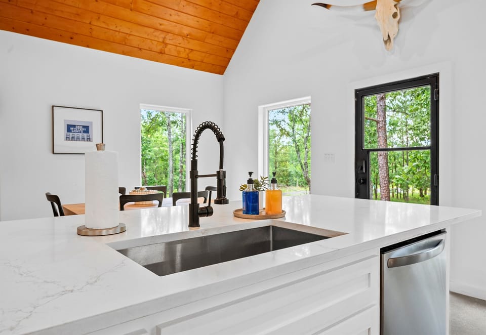 Sleek white kitchen with all the essentials for a festive feast.