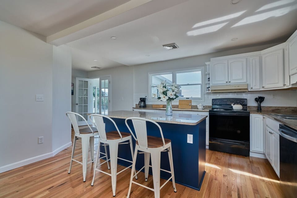 The perfect social hub. Our modern breakfast bar features comfortable seating for three, making it the ideal spot for morning coffee or evening appetizers.