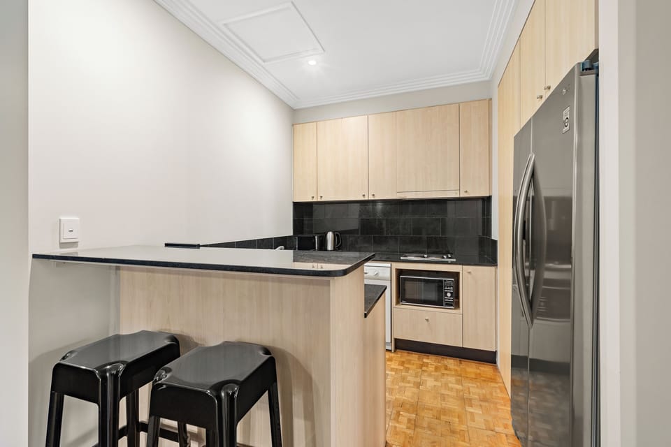 Executive Two Bedroom Apartment | Private kitchen | Fridge, microwave, stovetop, electric kettle
