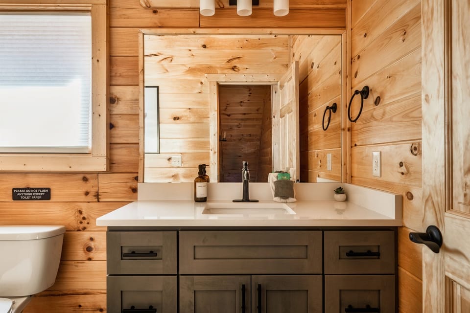 Powder room off the kitchen for convenience.